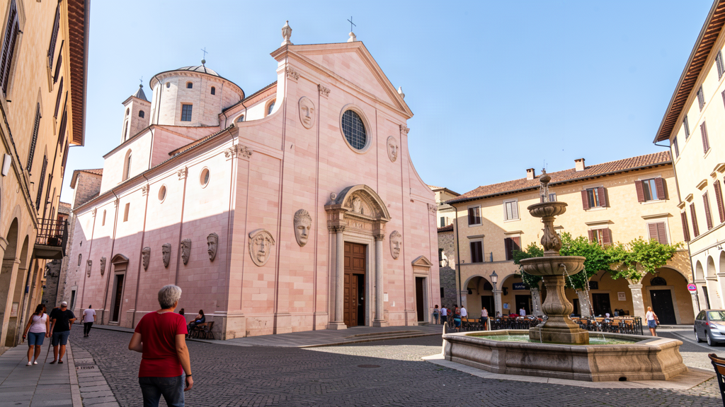 Pink and white façade of Santa Maria di Collemaggio in L'Aquila